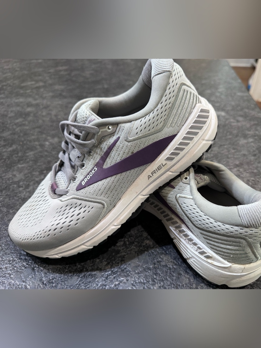 Brooks running shoes in light gray with purple stripe